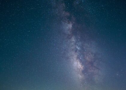 Stunning nightscape featuring the Milky Way galaxy visible over a tranquil desert road.